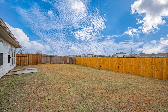 view of yard with a patio area and a fenced backyard