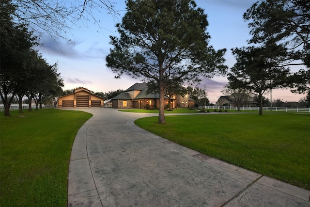 view of front of property featuring a front yard and fence