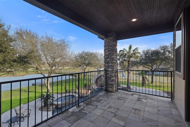 balcony featuring a water view