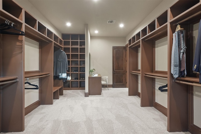 walk in closet with visible vents and carpet floors