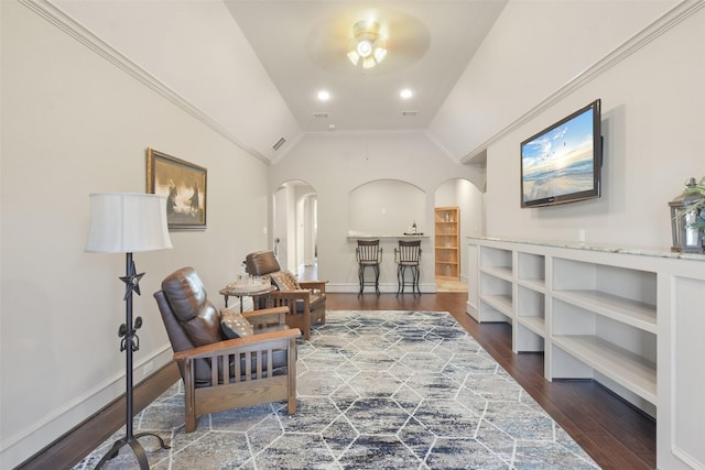 living area with lofted ceiling, baseboards, arched walkways, and dark wood-style flooring