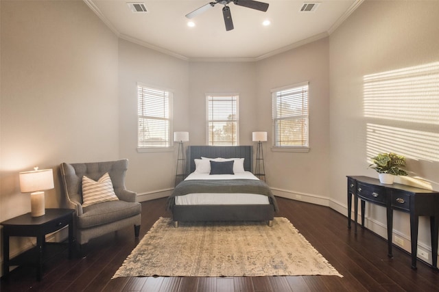 bedroom featuring crown molding, dark wood-style floors, visible vents, and baseboards