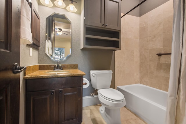 bathroom featuring baseboards, shower / bath combo with shower curtain, toilet, a textured wall, and vanity