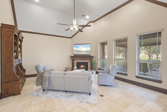 living room featuring crown molding, stone tile floors, baseboards, and high vaulted ceiling