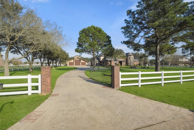 exterior space featuring a fenced front yard and a lawn