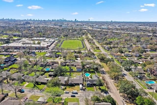 birds eye view of property featuring a city view