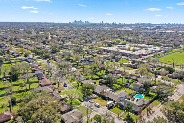 birds eye view of property with a view of city