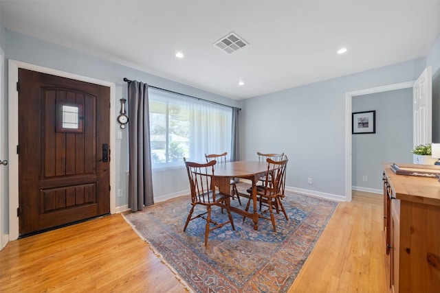 dining room with recessed lighting, visible vents, light wood-style flooring, and baseboards