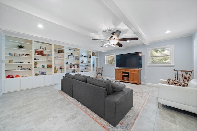 living room with beamed ceiling, plenty of natural light, a ceiling fan, and baseboards