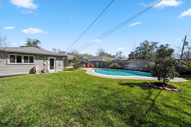 view of yard featuring a fenced in pool and fence private yard