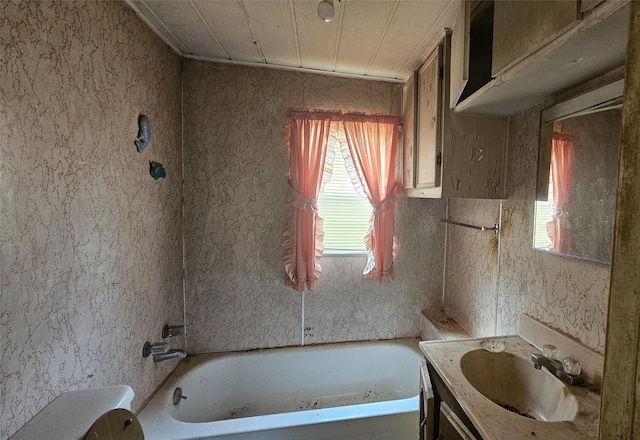 full bath with vanity and a washtub