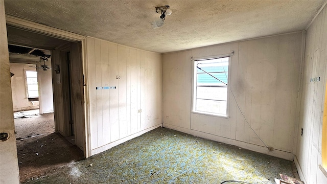 spare room with a textured ceiling