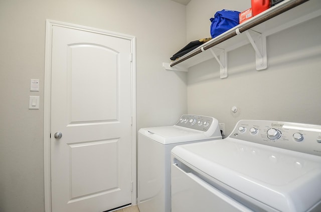 clothes washing area with laundry area and independent washer and dryer