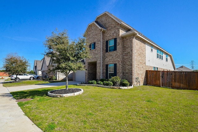 view of side of home featuring fence, a lawn, concrete driveway, and brick siding