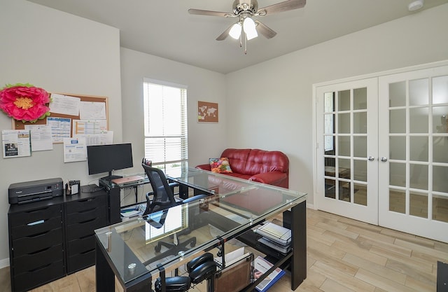 office featuring light wood-style floors, ceiling fan, and french doors