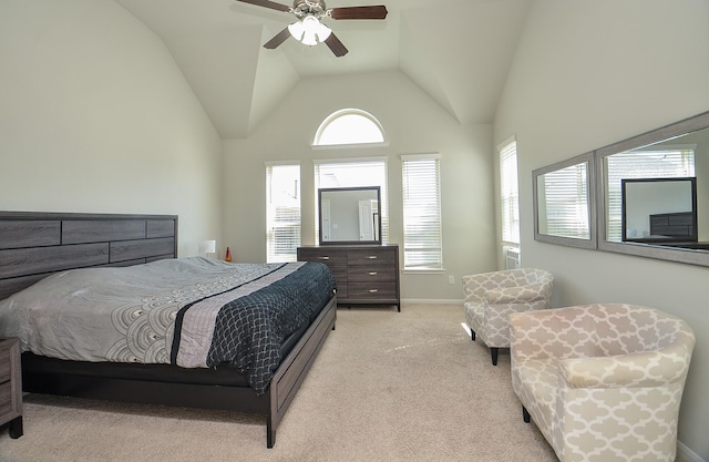 bedroom featuring light carpet, high vaulted ceiling, ceiling fan, and baseboards