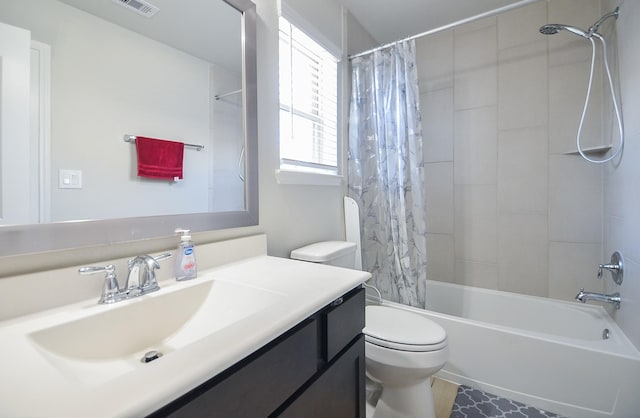 bathroom featuring shower / bath combo, vanity, and toilet