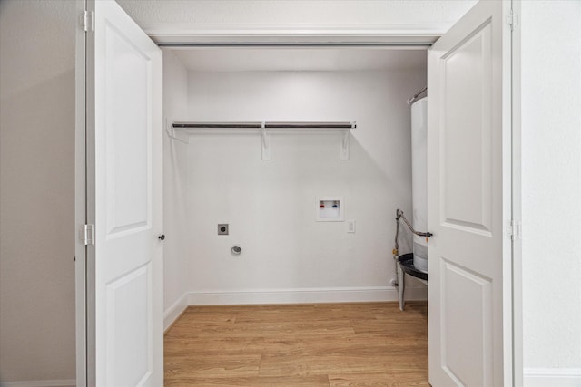 clothes washing area featuring washer hookup, light wood finished floors, hookup for a gas dryer, electric dryer hookup, and laundry area