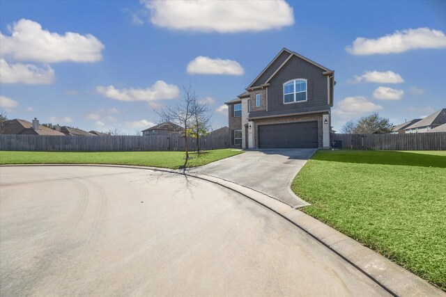 traditional-style home with driveway, a front lawn, an attached garage, and fence