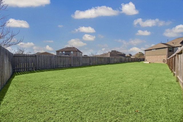 view of yard featuring a fenced backyard