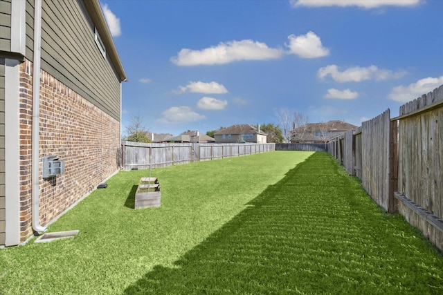 view of yard featuring a fenced backyard