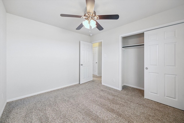 unfurnished bedroom with ceiling fan, a closet, baseboards, and carpet flooring