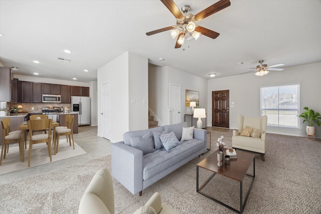 living room featuring recessed lighting, visible vents, stairway, ceiling fan, and baseboards