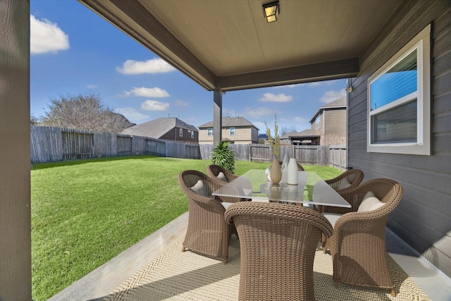 view of patio with outdoor dining area and a fenced backyard