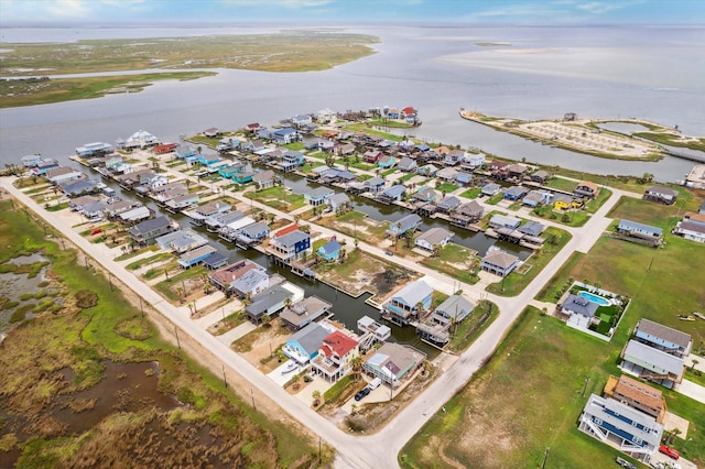 drone / aerial view featuring a water view and a residential view