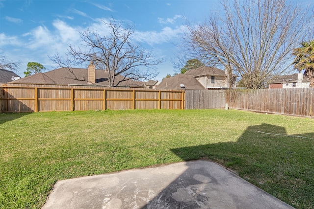 view of yard with a patio and a fenced backyard