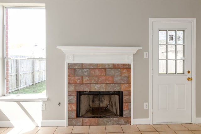 details featuring a fireplace with flush hearth and baseboards