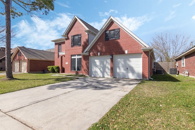 traditional-style home with driveway, brick siding, a front yard, and central air condition unit