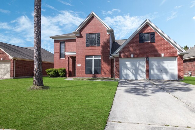 traditional home featuring driveway, a front lawn, and brick siding