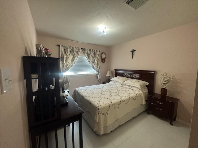 bedroom with visible vents