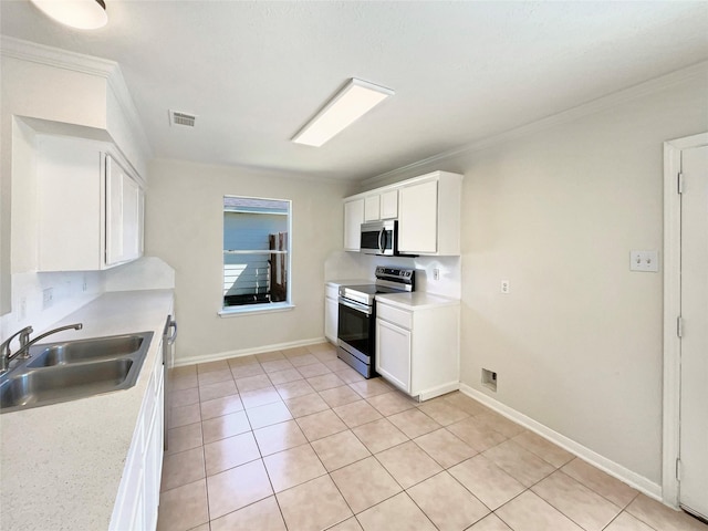 kitchen featuring visible vents, appliances with stainless steel finishes, light tile patterned flooring, white cabinets, and a sink