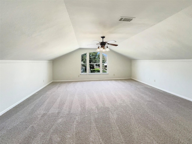 bonus room featuring carpet flooring, ceiling fan, baseboards, and vaulted ceiling