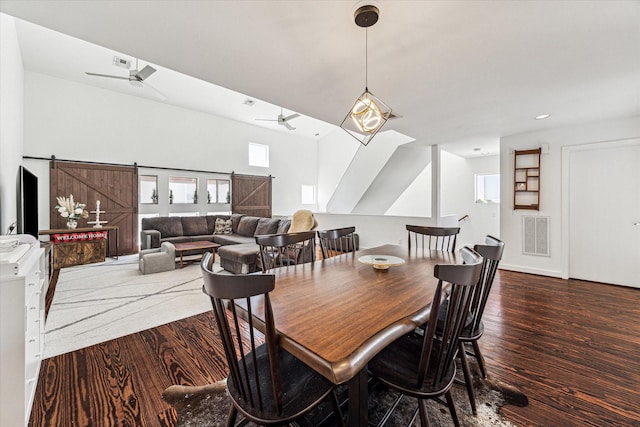 dining space with visible vents, dark wood finished floors, recessed lighting, a barn door, and ceiling fan