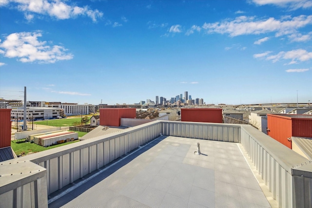 view of patio with a city view and a balcony