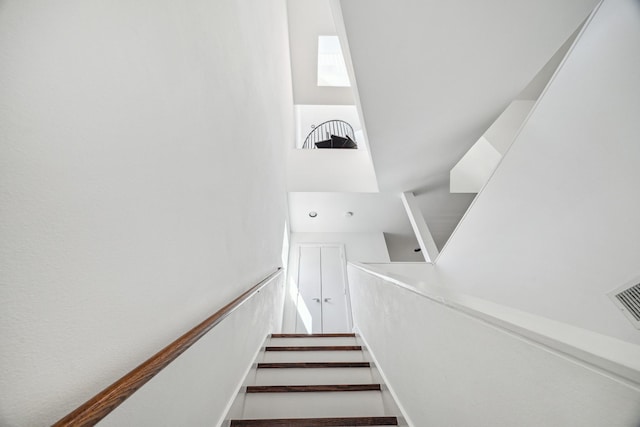 staircase featuring visible vents