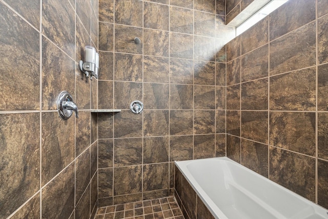 full bathroom with a relaxing tiled tub and a tile shower