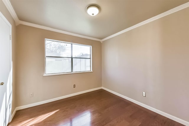 unfurnished room with wood finished floors, baseboards, and ornamental molding