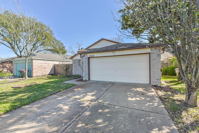 detached garage featuring fence