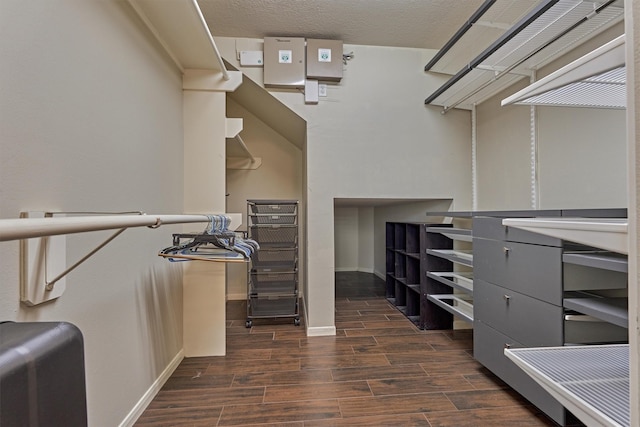 walk in closet with wood tiled floor