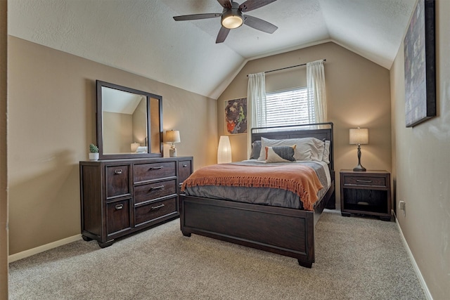 bedroom featuring baseboards, lofted ceiling, and light carpet