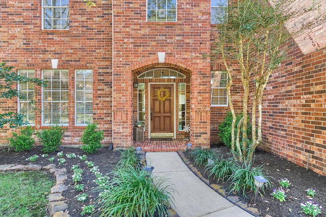 entrance to property with brick siding