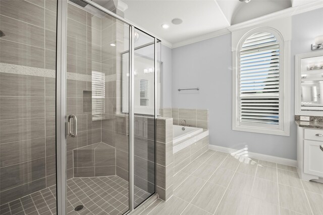 full bath with a garden tub, vanity, baseboards, ornamental molding, and a stall shower