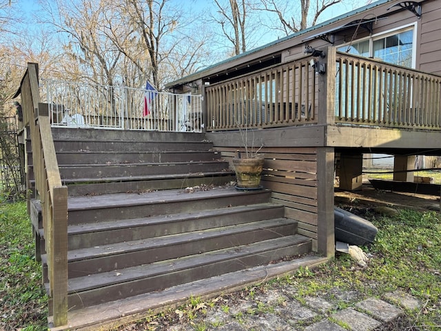 wooden deck featuring stairs