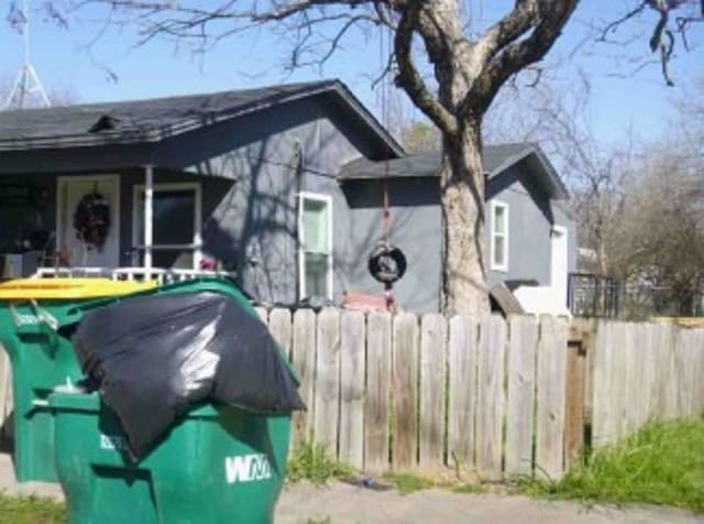 view of home's exterior featuring fence