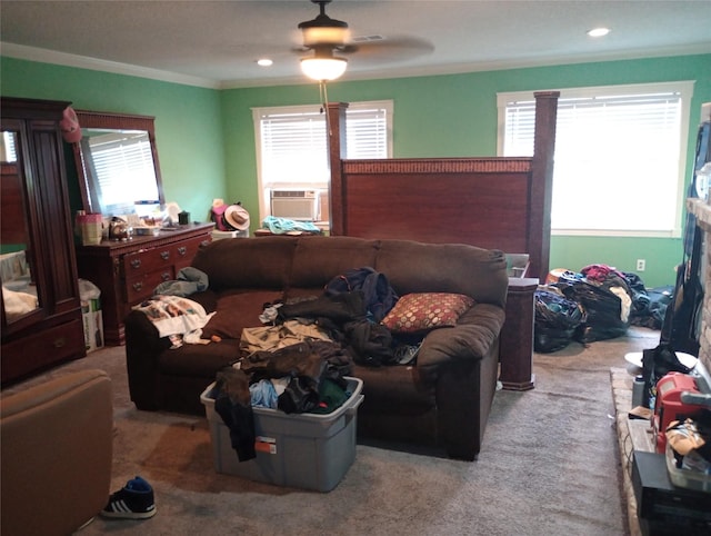 living room with plenty of natural light, carpet flooring, and crown molding