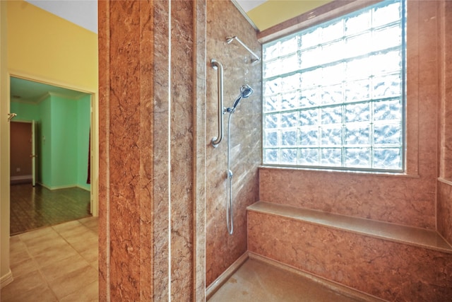 full bath with a tile shower